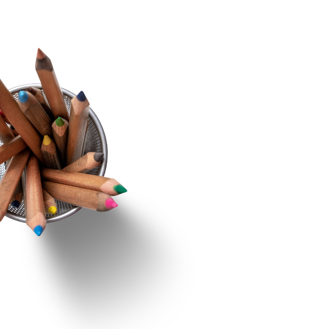 A top-down view of several colored pencils with natural wood casings in a metal mesh pencil holder, isolated on a white background—an inviting image for a trauma psychologist’s creative workspace.