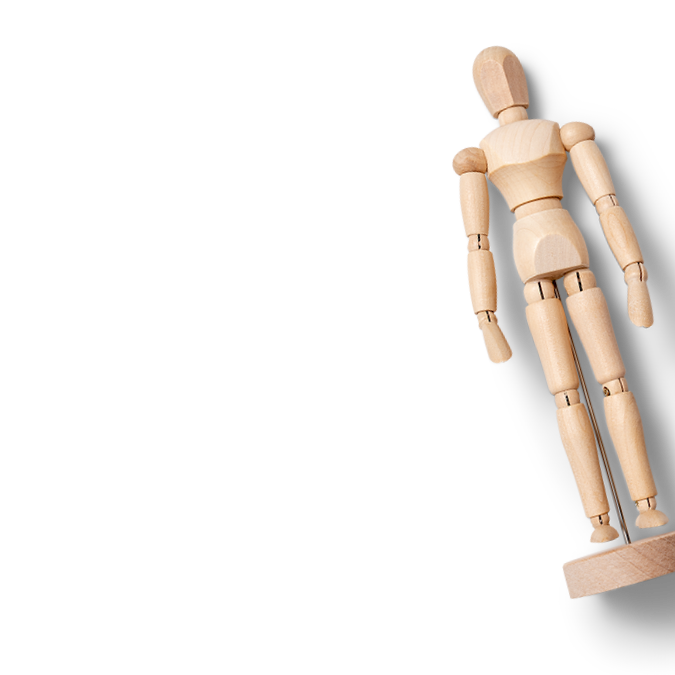 A wooden artist’s mannequin leans diagonally to the right on a stand against a plain black background, subtly evoking the delicate balance often discussed in mental health resources. The figure’s arms and legs are slightly bent.